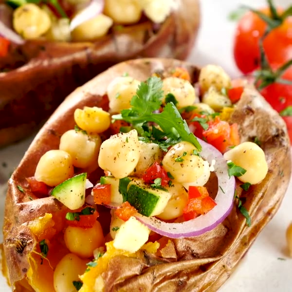 Food inspiration: baked sweet potato boats filled with chickpeas, vegetables and fresh herbs